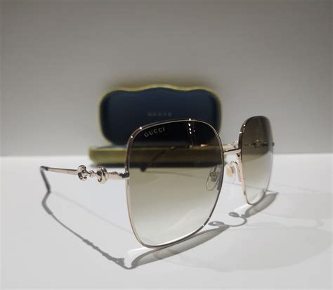 Gucci GG 0879S 002 Gold Metal Square Sunglasses.